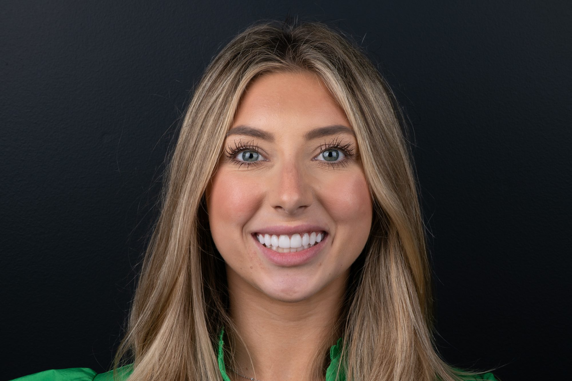 A patient photographed in the Smile On Nashville studio