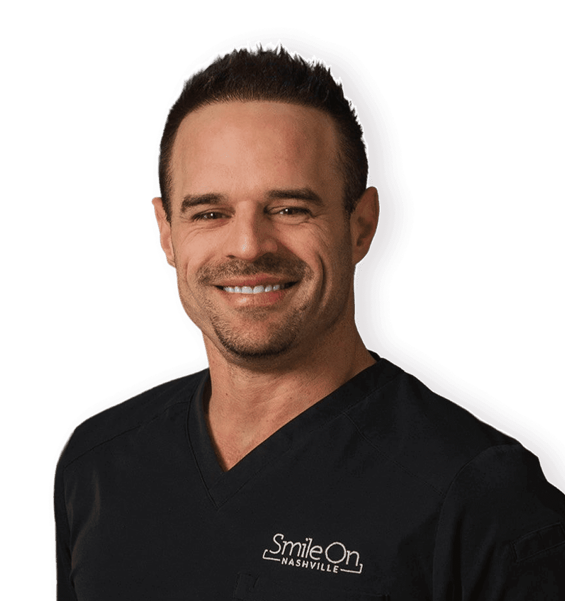 Dr. Jeff Trembley smiling in a black Smile On Nashville scrub top