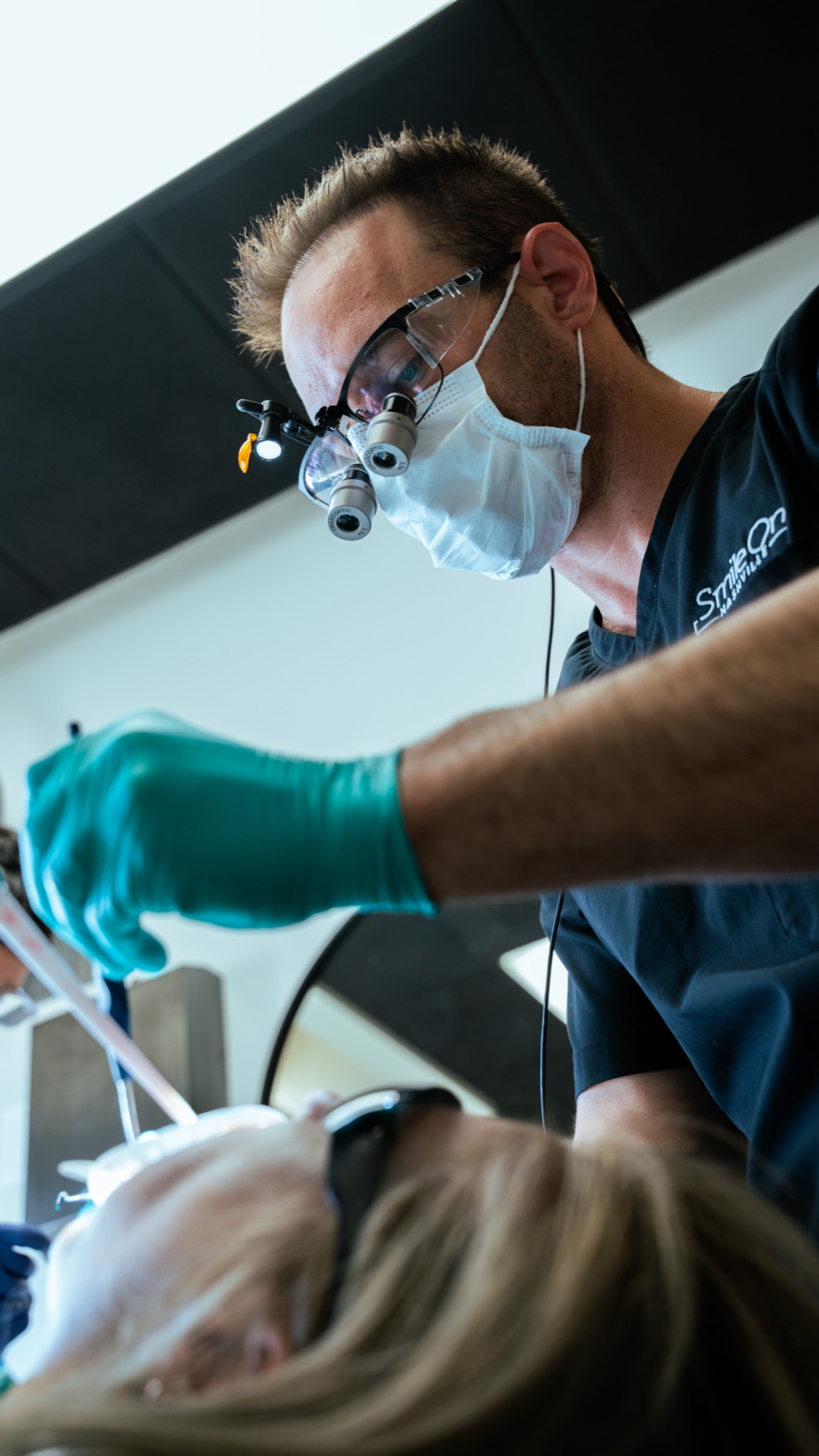 Dr. Jeff Trembley placing veneers for a patient at Smile On Nashville